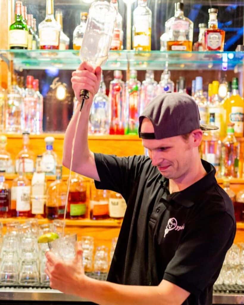 Bartender pouring drinks at Ozzie's 