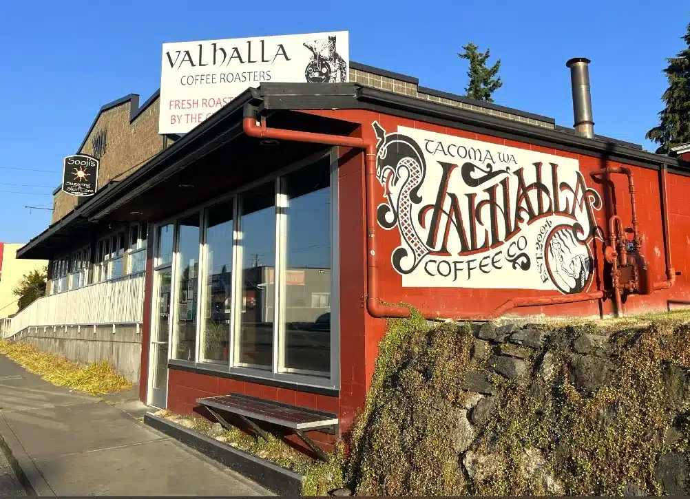 Valhalla exterior view with sign for the store on the roof of the shop