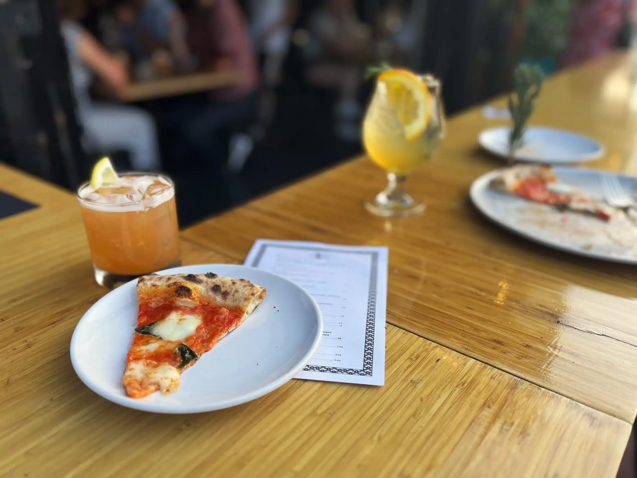 Pizza and cocktails on the bar counter