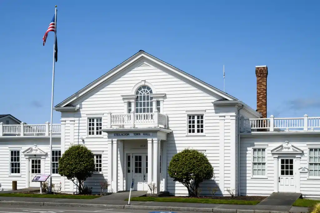 Steilacoom Town Hall on a nice sunny day with American Flag flying high