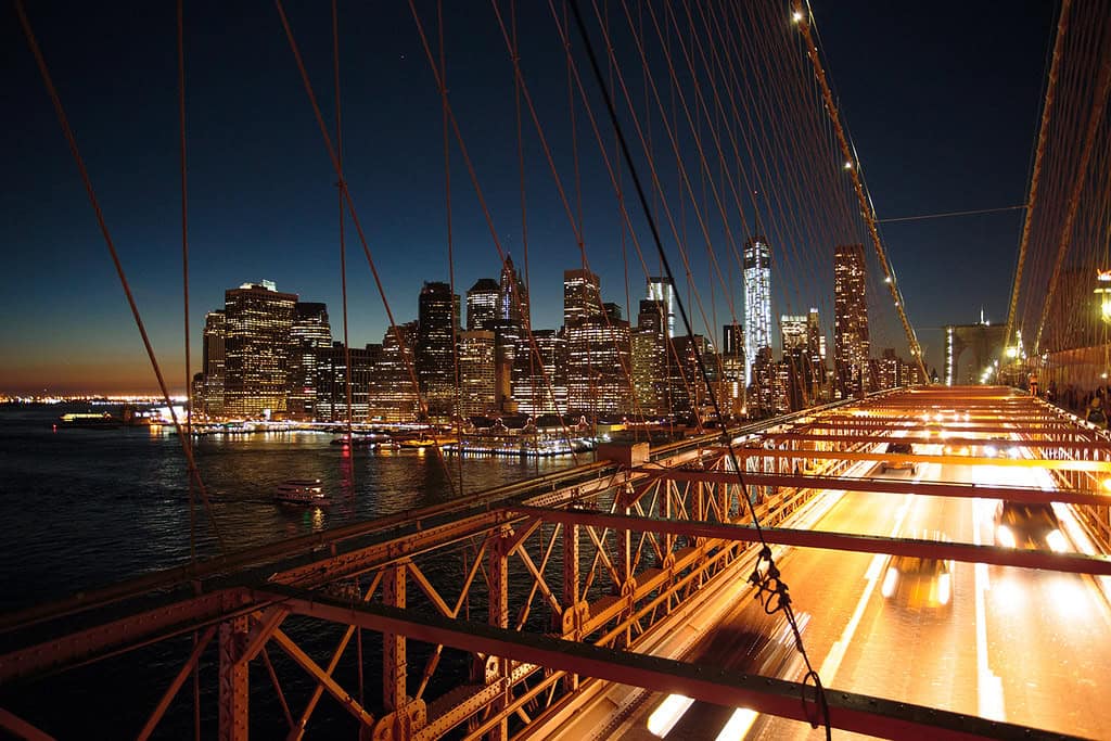 Brooklyn Bridge and Manhattan skyline (One World Trade Center) at night, New York